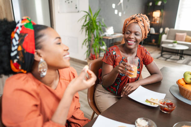 istock Female friends enjoying their breakfast in the kitchen 1474801332