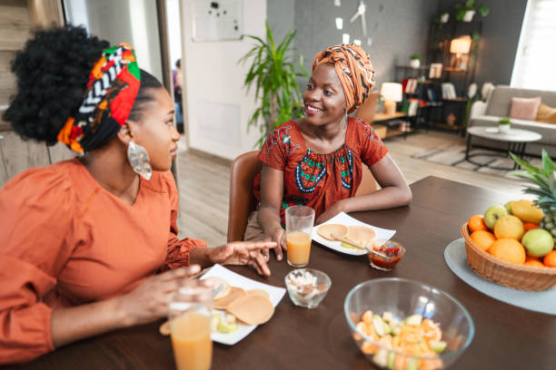 istock Female friends enjoying their breakfast in the kitchen 1474801403