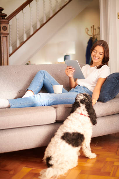 istock young woman chilling with her dog 1474804785