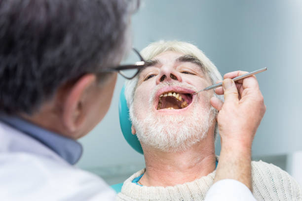 istock Senior man at dentist office. 1474805067