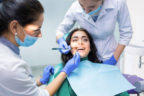 istock Dental doctors examining patient. 1474805389