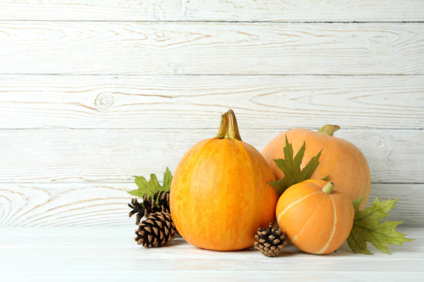istock Thanksgiving Day composition with pumpkins on wooden table 1474806416