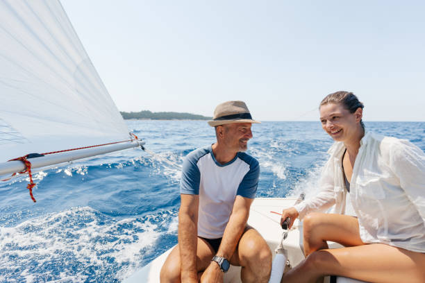 istock Mature couple sailing on the open sea 1474806575