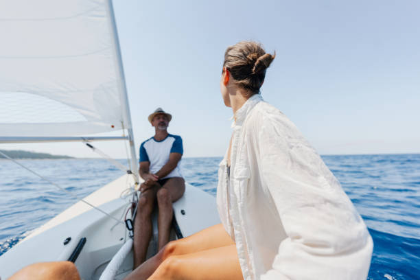 istock Mature couple sailing on the open sea 1474806642