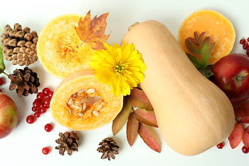 Lots of colorful ornamental pumpkins on a white background