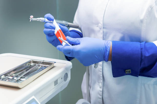 istock Hands of a dentist. 1474806788