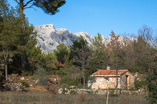 Aix-en-Provence, France: Terrain des Peintres (Painters’ Park), with Mont Sainte-Victoire in the distance. Now a public park, this is where Paul Cézanne came to paint Mont Sainte-Victoire. Copy space in the sky.