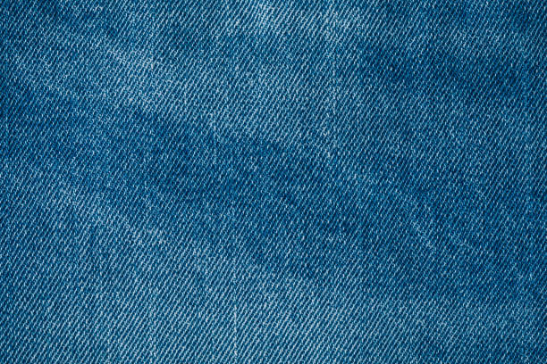 istock Jeans. Close-up of blue denim jeans texture background 1474812626