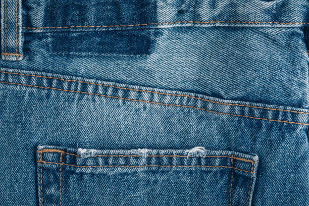 istock Jeans. Close-up of blue denim jeans texture background 1474813294