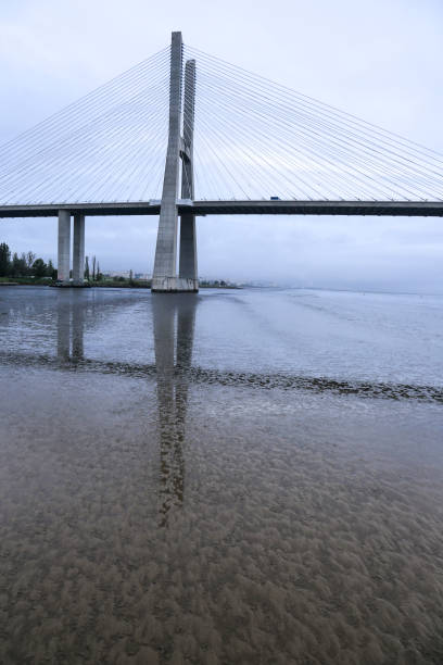 istock The Vasco Da Gama bridge on a cloudy day 1474815600