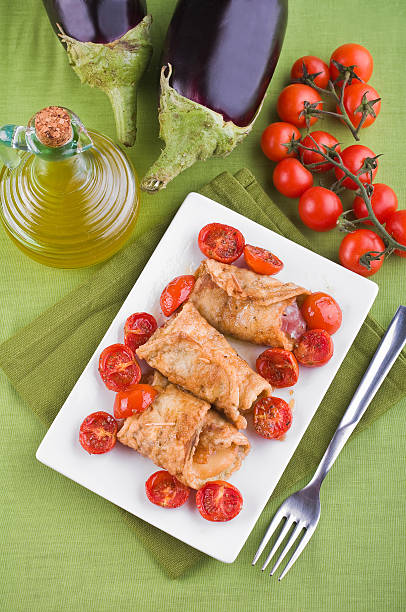 istock Eggplant roulades with cherry tomato salad. 147481689