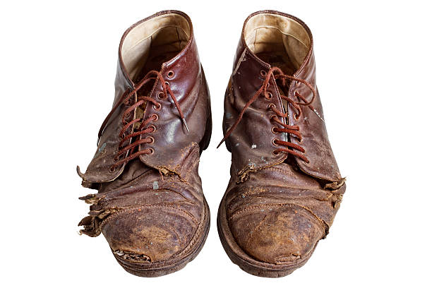 Old worn out boots stock photo