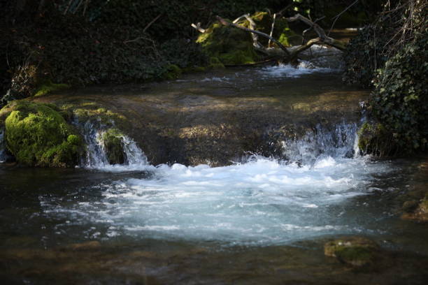 istock A small waterfall where the water falls straight into the river 1474821467