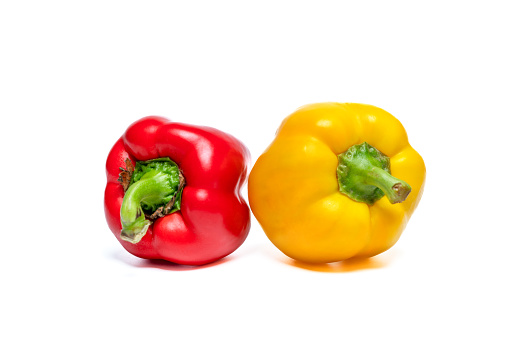 Red and yellow sweet bell pepper isolated on white background