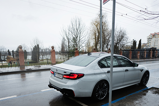 Ivano-Frankivsk, Ukraine - March, 2023: Gray BMW M 5 in street.
