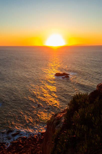 istock View of the Atlantic Ocean from Cabo da Roca at sunset. Cabo da Roca or Cape Roca is westernmost cape of mainland Portugal, continental Europe and the Eurasian land mass 1474825319