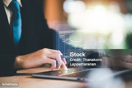 istock businessperson Updating schedules or planning business online, appointment time management ,work schedule plan ,Strategic Planning Concepts, brainstorm ideas on business plans ,planning software 1474825656