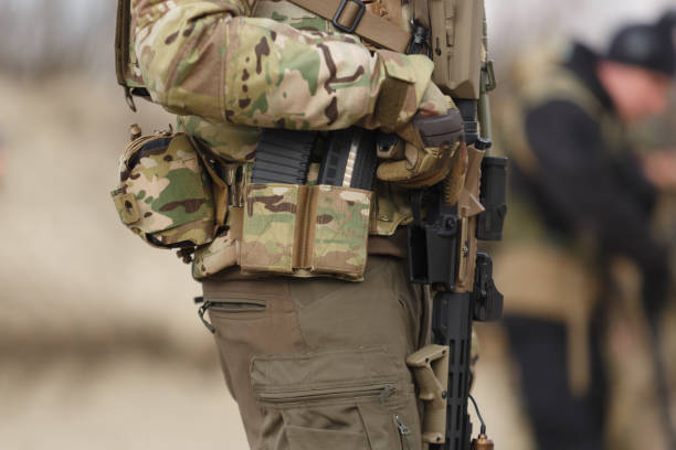 istock Ukrainian solider equipped with modern American assault rifle training at the shooting range outdoor 1474827609