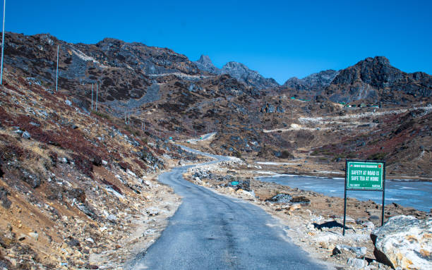 istock Bumla Pass road with frozen river 1474831295