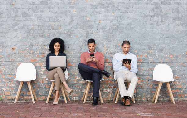 istock Diversity, recruitment or business people in digital agency data analysis interview, cyber security or hiring team. Teamwork, technology or employee in lobby for startup tech or SEO programmer job 1474831663