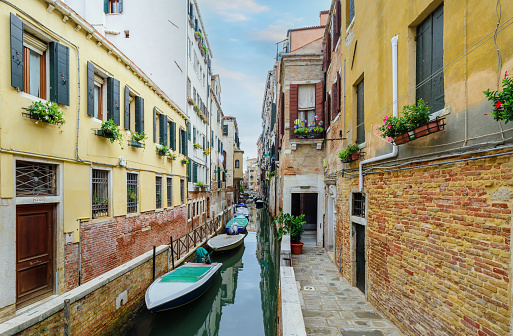 VENICE, Italy - September 30, 2022: Beautiful venetian street in summer day, Italy