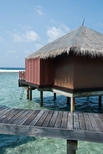 Nature sea landscape building on piles on Maldivian islands