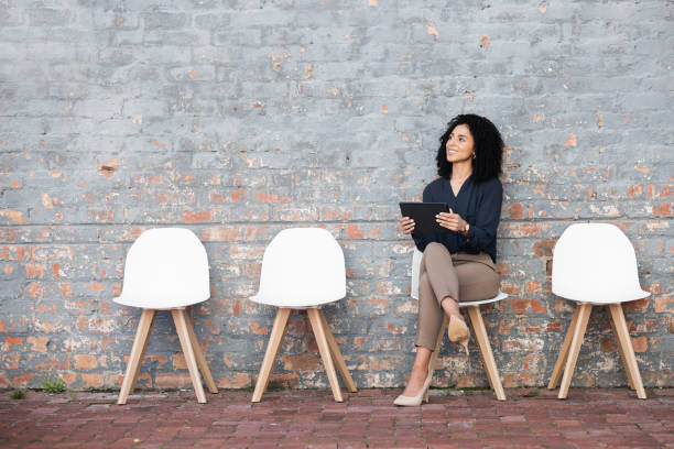 istock Thinking, recruitment and woman with a tablet for an interview, communication and information. Happy, thoughtful and employee with technology for hiring process, inspiration and idea for a job 1474833768