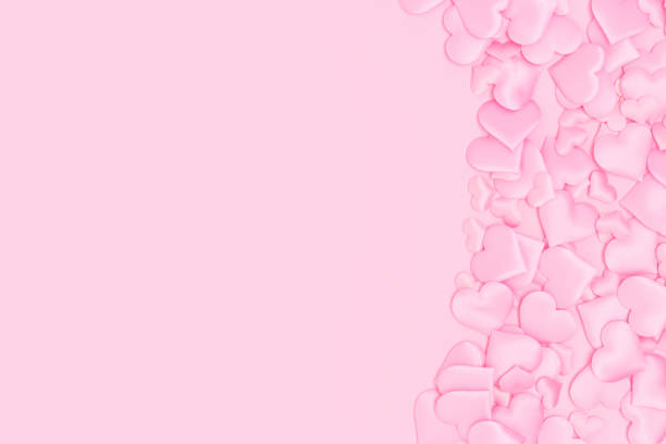 istock Textile hearts confetti on a pink background. 1474834424