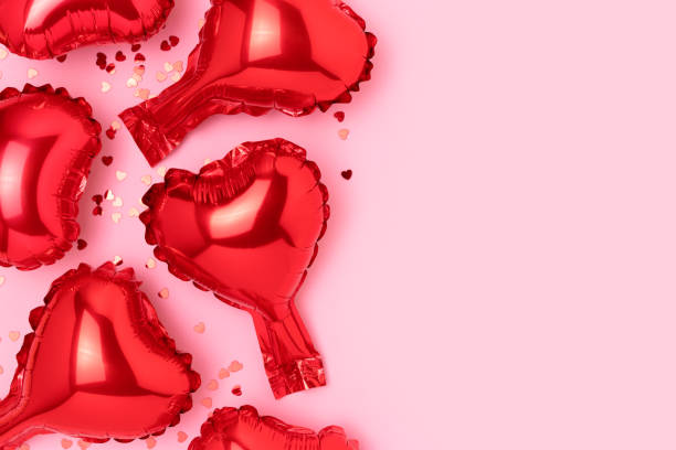 istock Red inflatable foil balloons in a heart shape. 1474834515