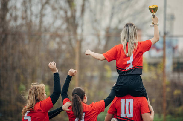 istock Female rugby team won a trophy 1474835114