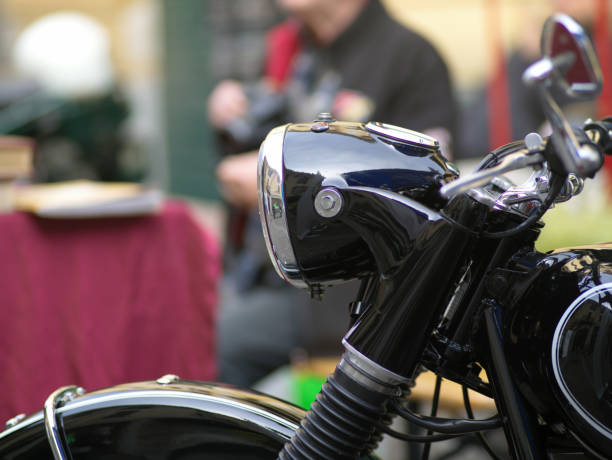 details of vintage motorcycles taken at a meeting on a public road