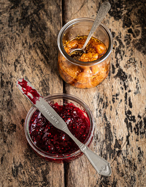 fresh homemade raspberry jam and gooseberry jam - berry fruit currant variation gooseberry imagens e fotografias de stock