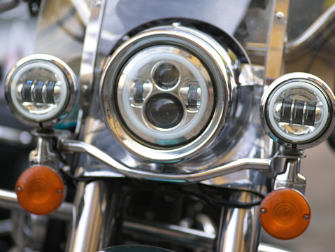 details of vintage motorcycles taken at a meeting on a public road