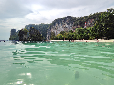 Tourists relaxing on the beach at the stunning Koh Hong island, Krabi province, Thailand