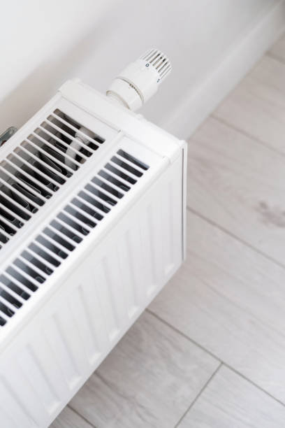 istock modern radiator heater with regulator knob indoors 1474837591