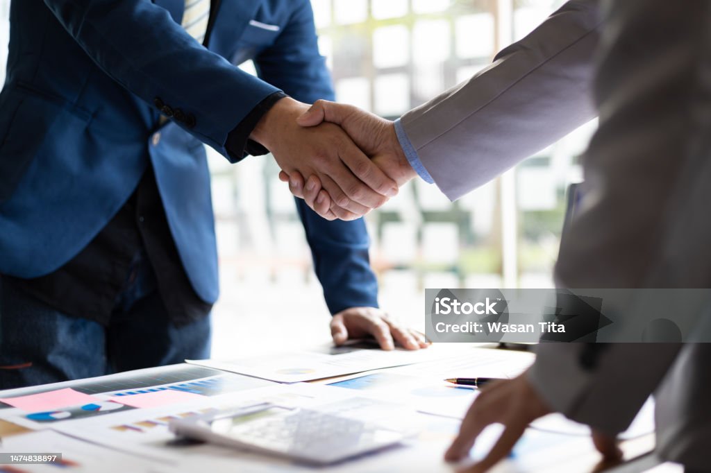 Business partner handshake after the meeting. Financial and investment cooperation. Business Stock Photo