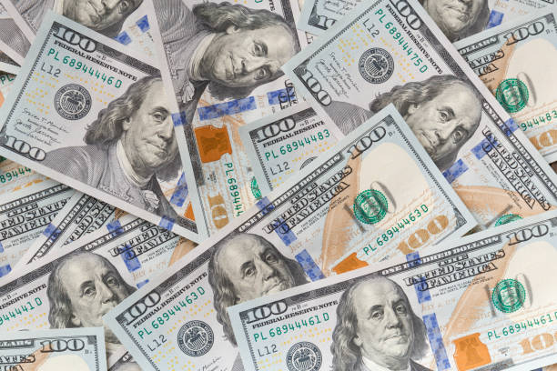 istock Background of 100 dollar bills 1474841024