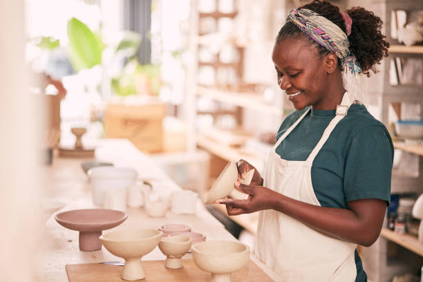 istock Ceramic store, creative pottery and black woman working on sculpture design mold, manufacturing or art product. Creativity, molding and startup small business owner, worker or girl in studio workshop 1474842999
