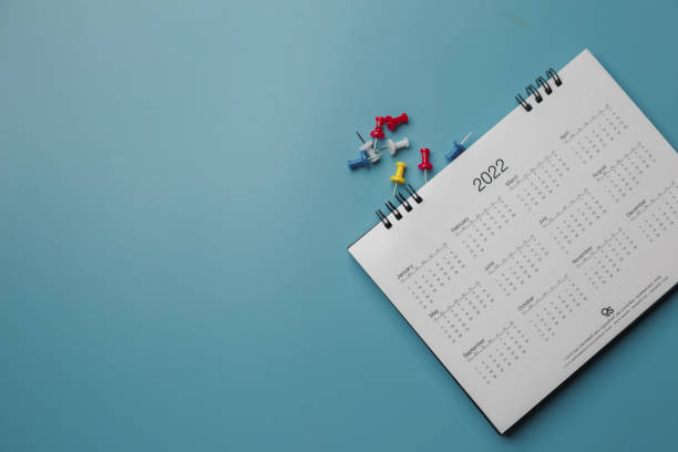 istock Embroidered red pins on a calendar event Planner calendar,clock to set timetable organize schedule,planning for business meeting or travel planning concept. 1474843099