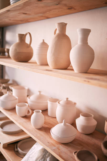 istock Backgrounds, shelf and pottery in creative workshop, store and manufacturing startup. Ceramics, collection and display in studio, small business and retail craft market, shop and stock production 1474844207