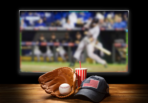 Baseball equipment on the table. USA game. TV watching concept