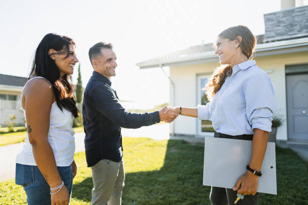 istock real state agent showing the new house 1474845921
