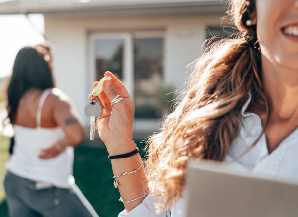 istock real state agent showing the new house 1474846186