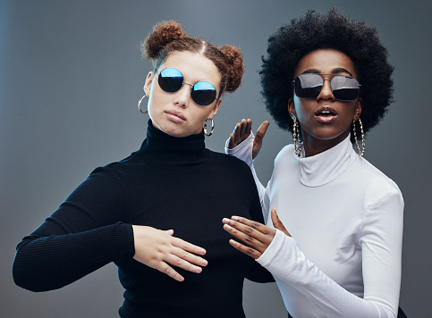 Fashion, women with sunglasses and futuristic with robotics, cyberpunk and trendy. Future design, females or girls with eyewear, gen z and marketing for tech development, fantasy or studio background