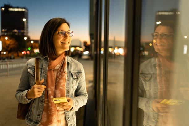 istock A woman is looking at a shop window 1474847427