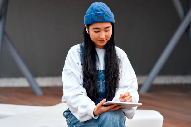 istock Asian woman outdoors 1474847809
