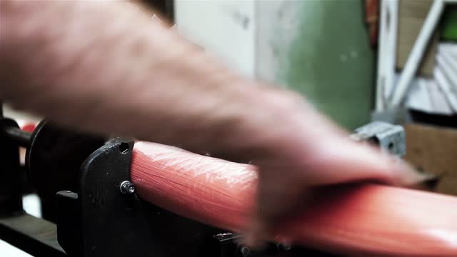 Worker Cutting Bunches of Synthetic Bristles using Metal Shears at Broom Factory. Close Up. 4K Resolution.