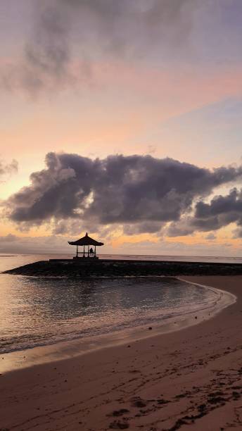 istock enjoy the sunset on the beach 1474848973