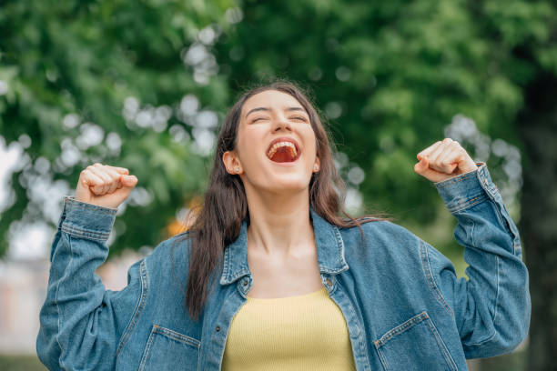 istock girl screaming free excited with joy 1474850735