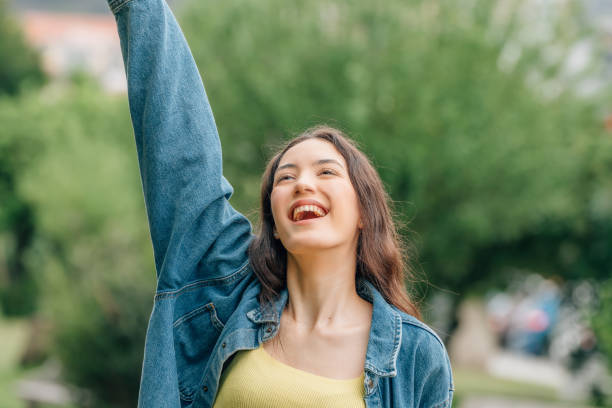 istock happy young girl expressing joy and fun 1474850885